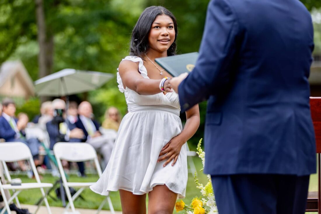 student receiving diploma