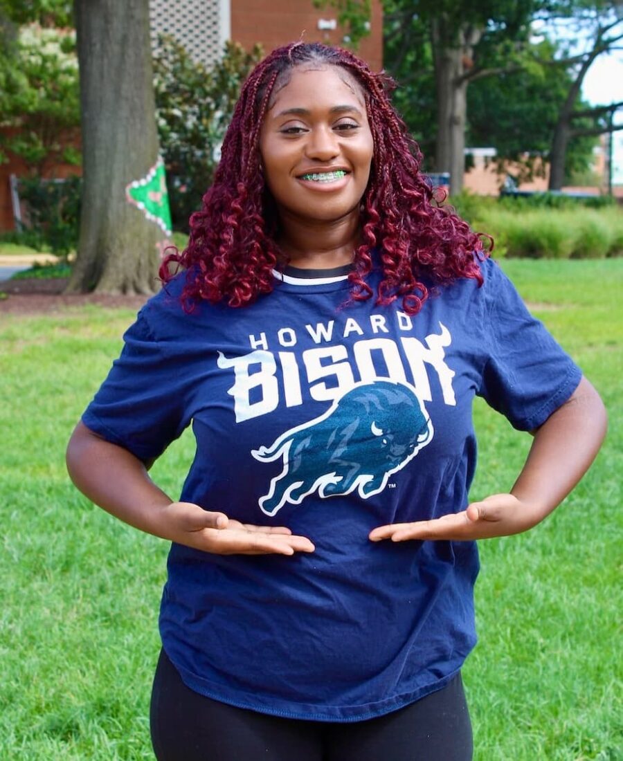 Smiling young woman wearing Howard Bison tshirt