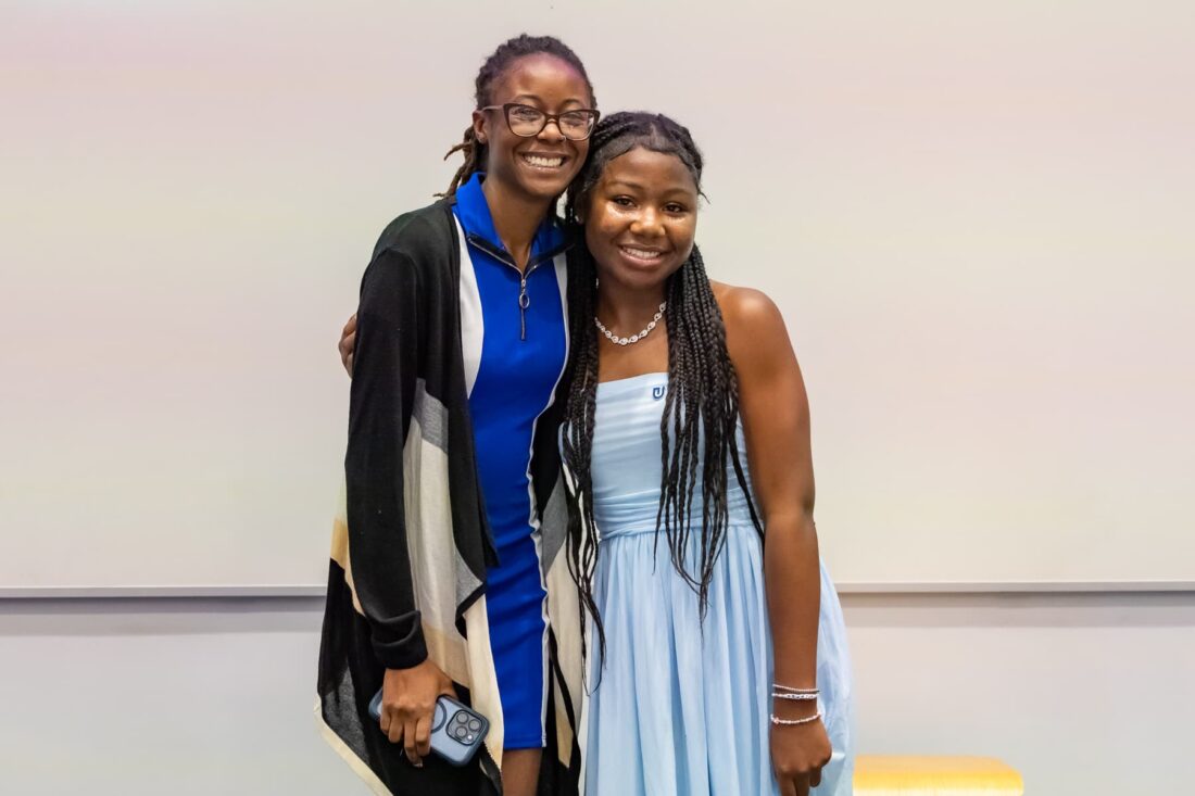 two smiling female students
